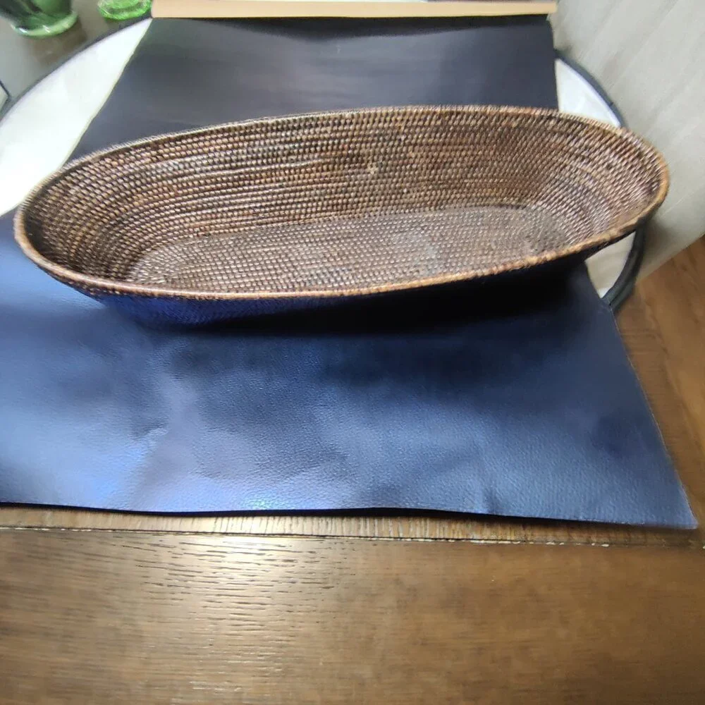 Woven bread basket is long and rectangular oval shape. The weave is exceptional